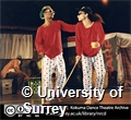 A male and female dancer acting as blind people, with sunglasses, canes, and a cup. Photographer: Chris Smart.