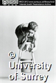 Yolande Snaith on a white stool with a white bucket.