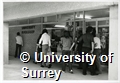 Photographs of students standing outside the bookshop at the University of Surrey Stag Hill Campus
