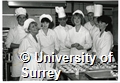 Photograph of students in the Hotel and Catering Department at the University of Surrey preparing food in a kitchen