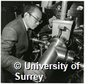 Photographs of Takuya Komoda, Manager of Matsuchita Electric Works Limited based at Surrey Research Park, working in the Spectroscopy Laboratory in the Department of Electronic and Electrical Engineering at the University of Surrey. Also, a copy of issue 5 volume 2 of 'Surrey Matters' newsletter of the University of Surrey, which published the photographs